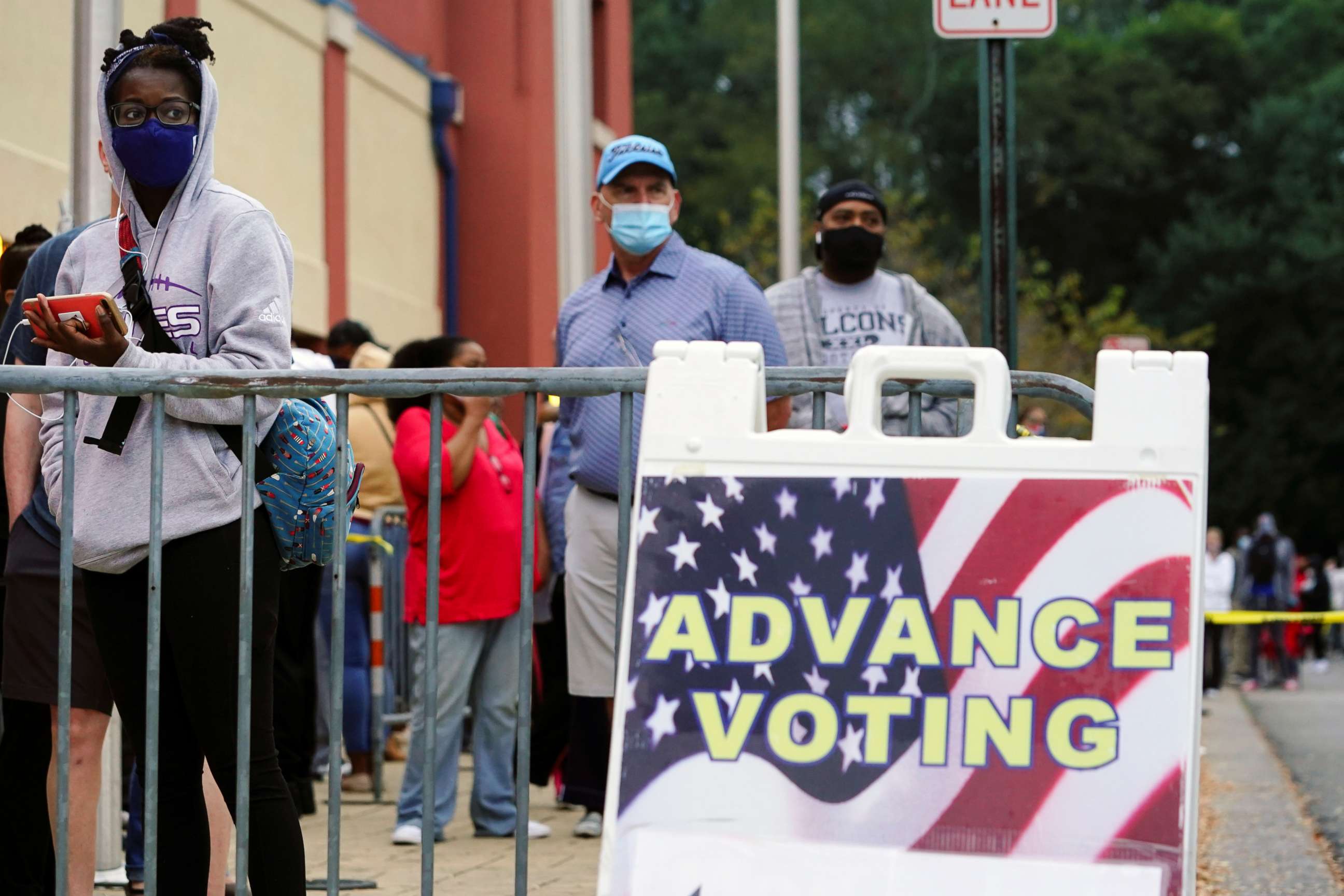 PHOTO: Voters line up to cast their election ballot at a Cobb County polling station in Marietta, Georgia, Oct. 13, 2020.