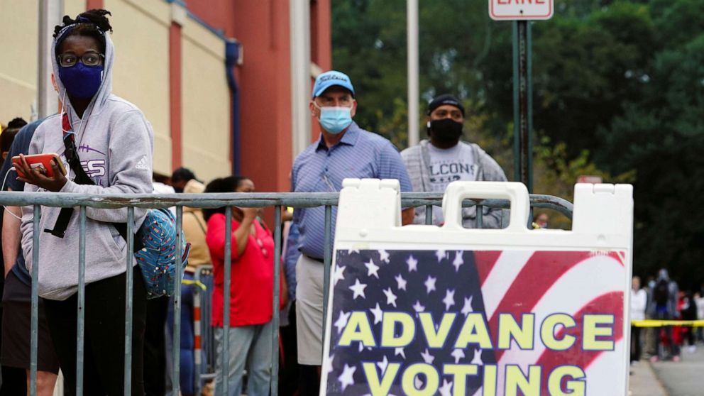 PHOTO: Voters line up to cast their election ballot at a Cobb County polling station in Marietta, Georgia, Oct. 13, 2020.