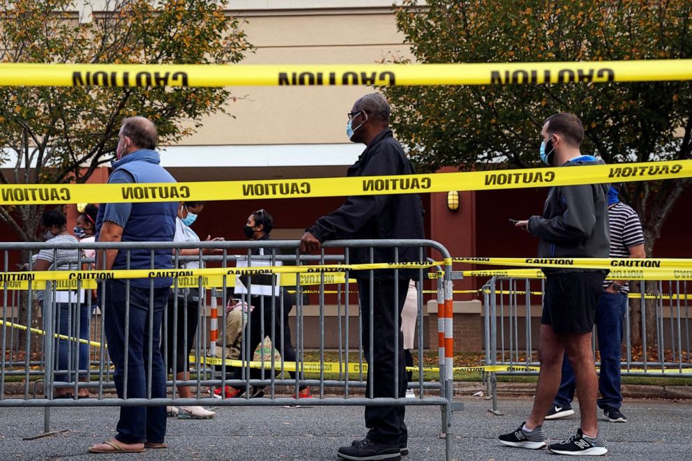 PHOTO: Voters line up to cast their election ballot at a Cobb County polling station in Marietta, Georgia, Oct. 13, 2020.