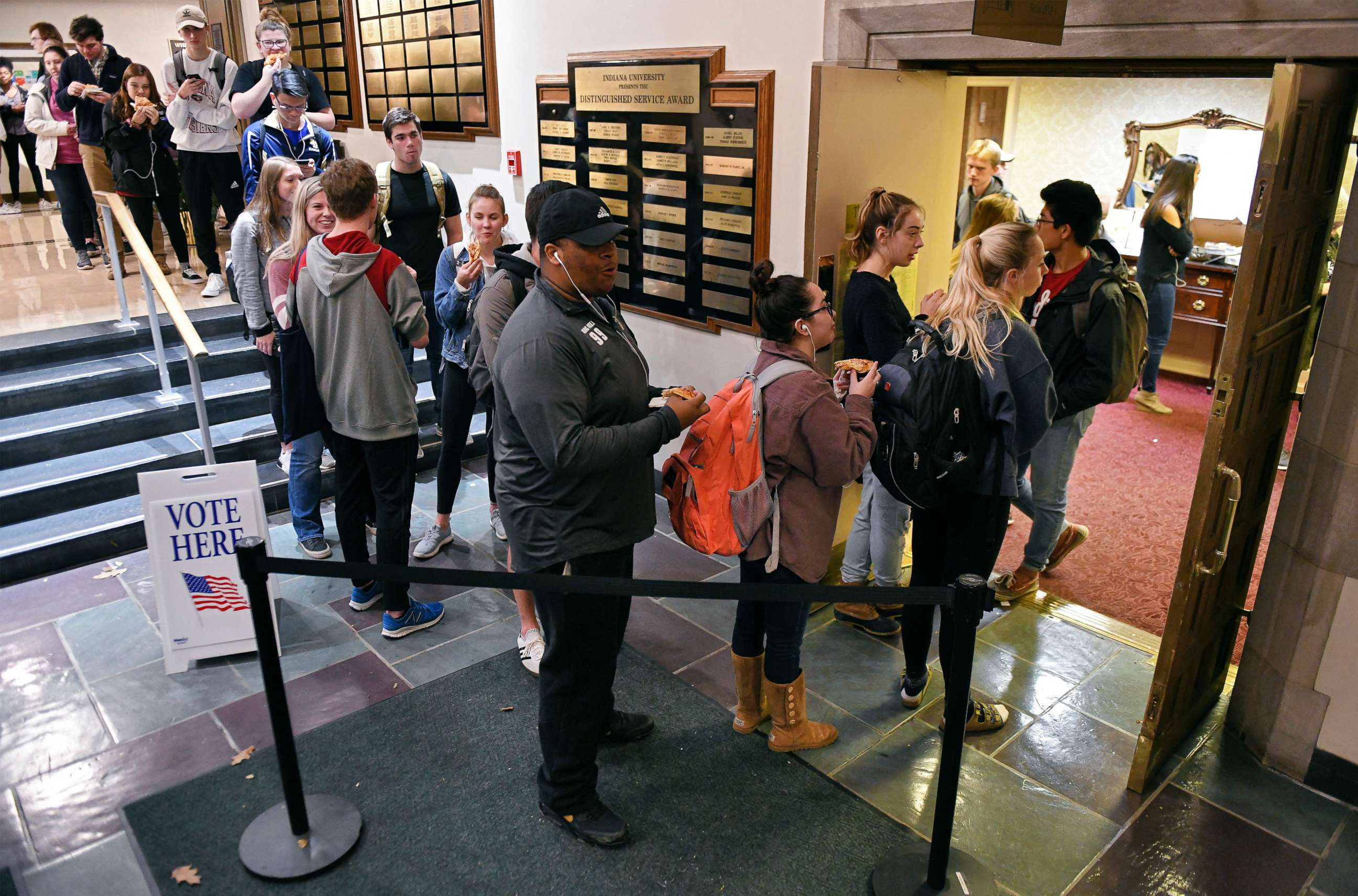 PHOTO: Voters wait in lines outside the University Club Room at the Indiana Memorial Union polling location in Bloomington, Ind., Nov. 6, 2018.