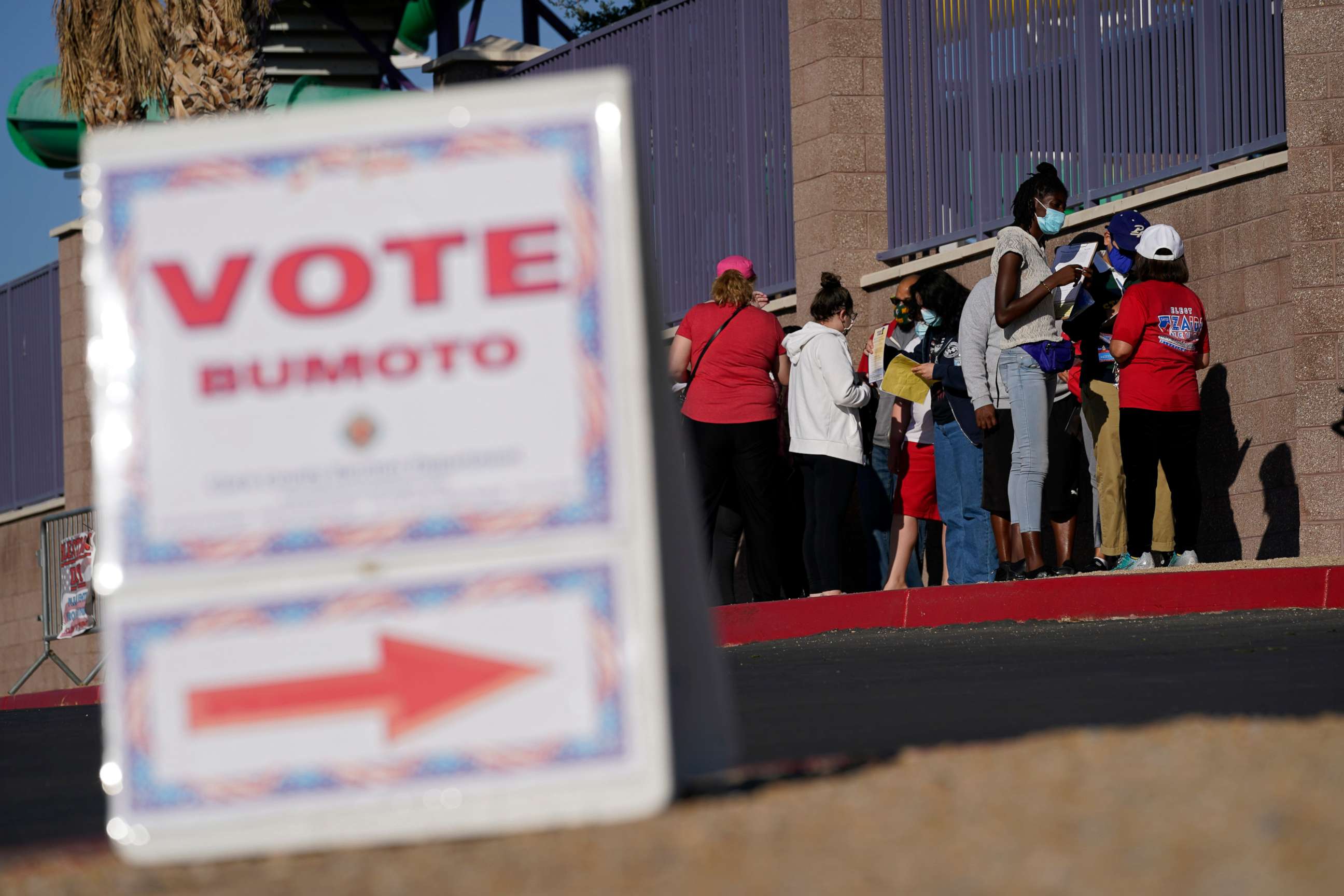 PHOTO: People wait in line to vote at a polling place on Election Day, Nov. 3, 2020, in Las Vegas.