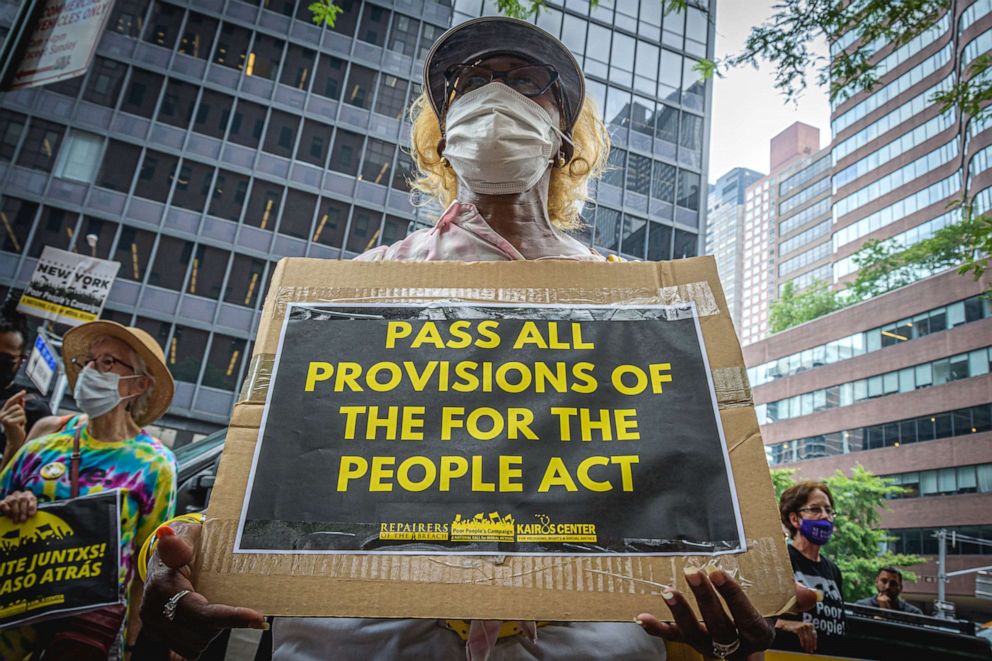 PHOTO: In this July 26, 2021, file photo, a protester hold a sign during a rally in New York.