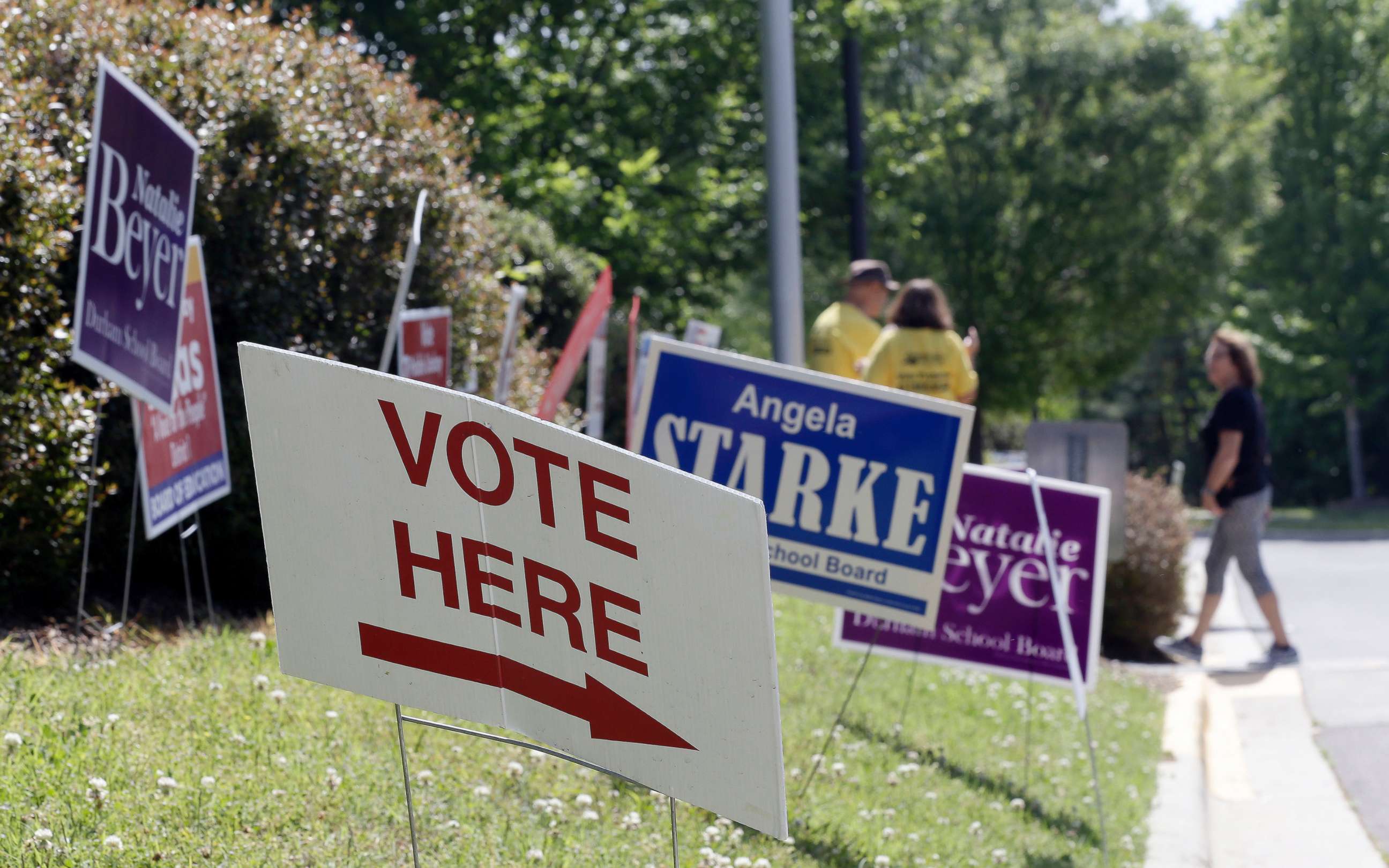 PHOTO: Voting signs line the sidewalk in Durham, N.C., May 8, 2018.