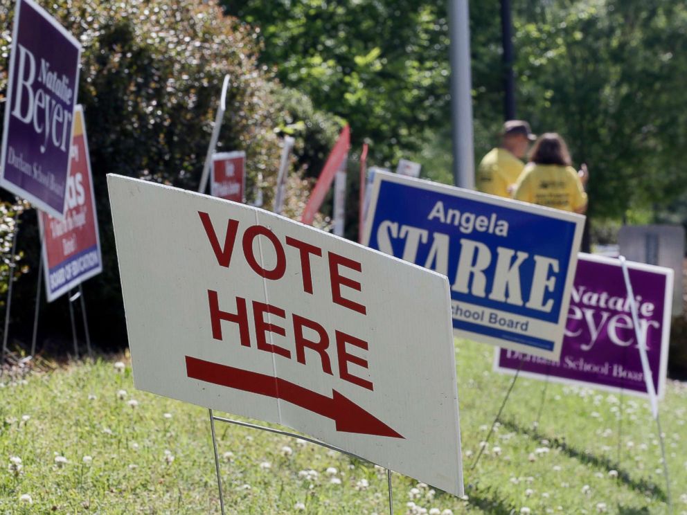 PHOTO: Voting signs line the sidewalk in Durham, N.C., May 8, 2018.