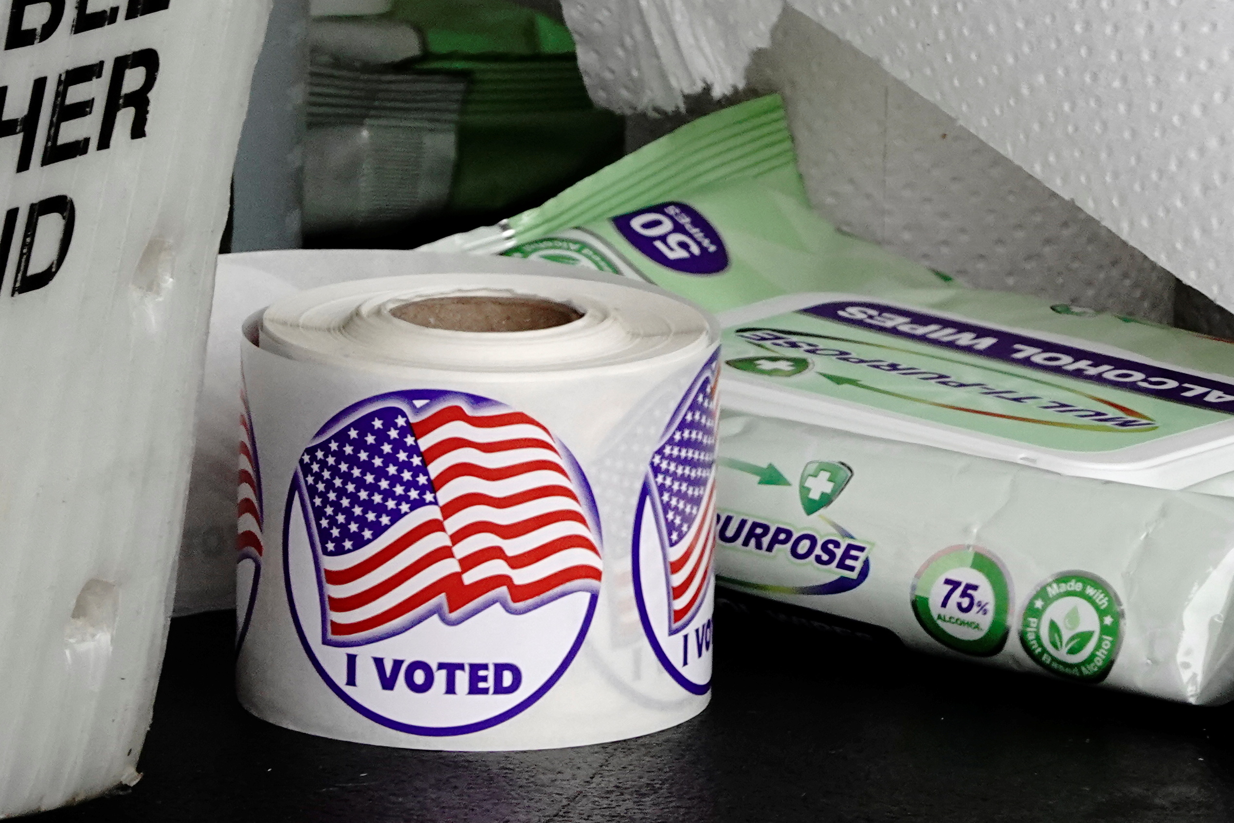 PHOTO: A roll of "I Voted" stickers is seen next to a packet of alcohol wipes at a drive-thru early voting site in the City Hall parking lot in Eau Claire, Wis., Oct. 23, 2020. 