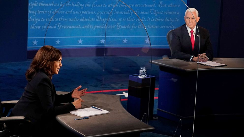 PHOTO: Vice President Mike Pence looks at Democratic vice presidential candidate Sen. Kamala Harris, as she answers a question during the vice presidential debate, Oct. 7, 2020, at the University of Utah in Salt Lake City.