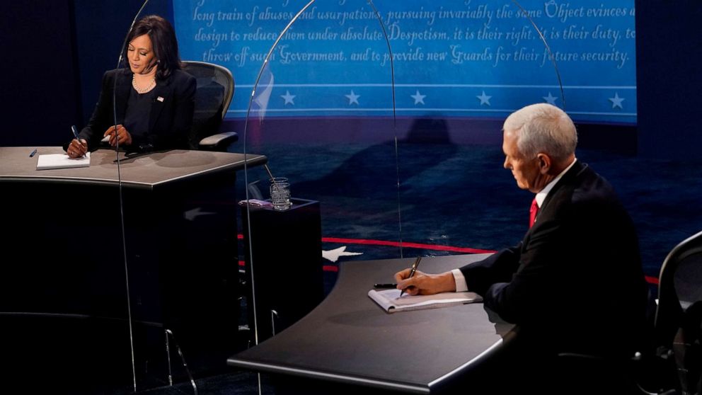 PHOTO: Democratic vice presidential nominee Senator Kamala Harris and Vice President Mike Pence take notes during the 2020 vice presidential debate in Salt Lake City, Oct. 7, 2020.
