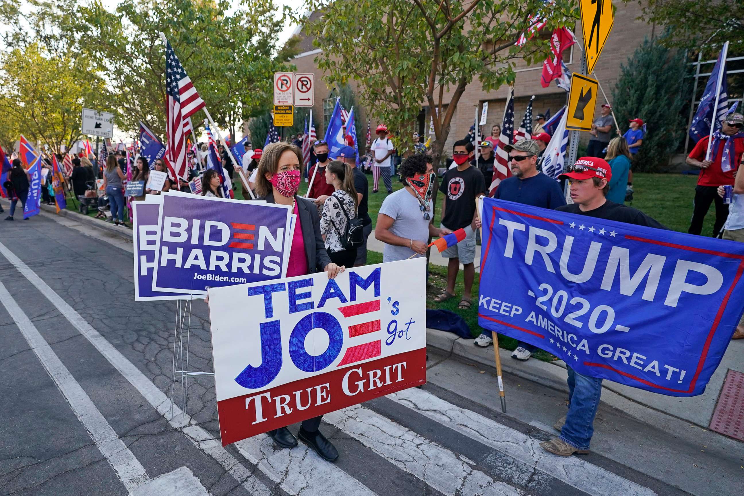 PHOTO: People holding signs in support gather near the site of the vice presidential debate between Vice President Mike Pence and Sen. Kamala Harris, at the University of Utah Oct. 7, 2020, in Salt Lake City.