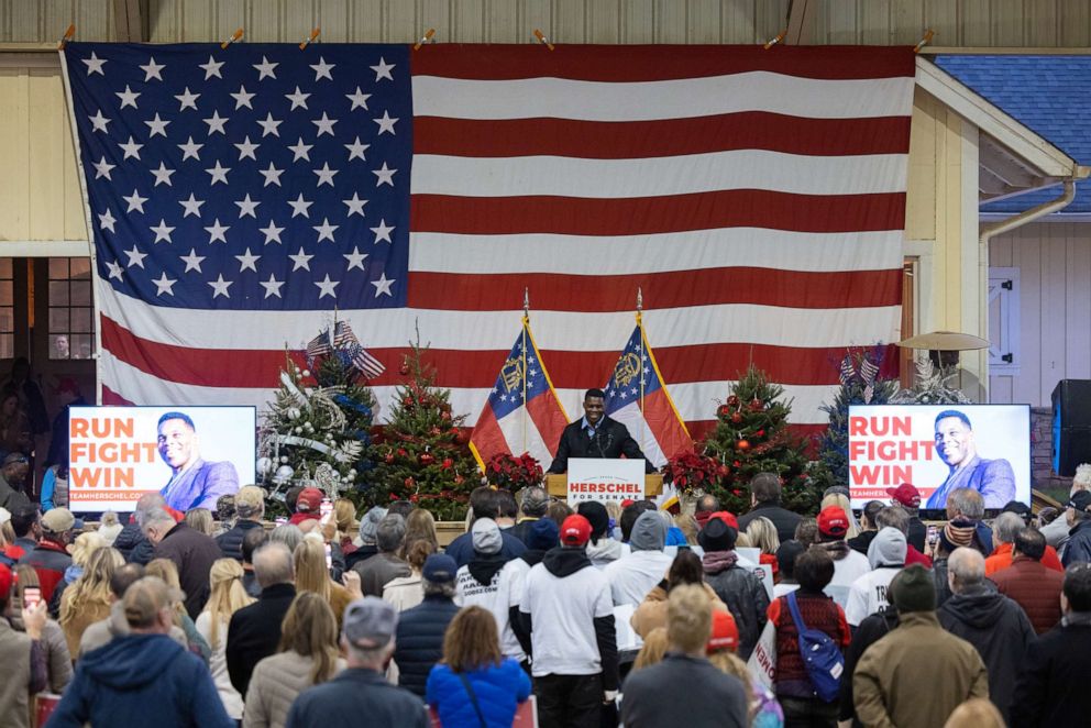 PHOTO: Republican Senate nominee Herschel Walker speaks to a crowd gathered for a rally with prominent Republicans on November 21, 2022 in Milton, Georgia.