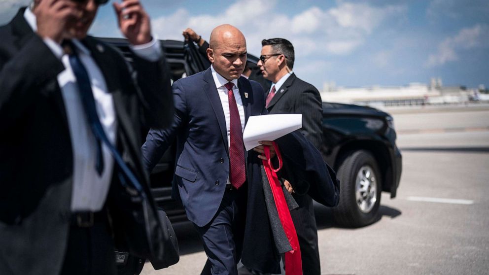 PHOTO: In this March 13, 2023, file photo, Walt Nauta, aid to former President Donald Trump, follows Trump as they board his airplane, known as Trump Force One, in route to Iowa, at Palm Beach International Airport in West Palm Beach, Fla.