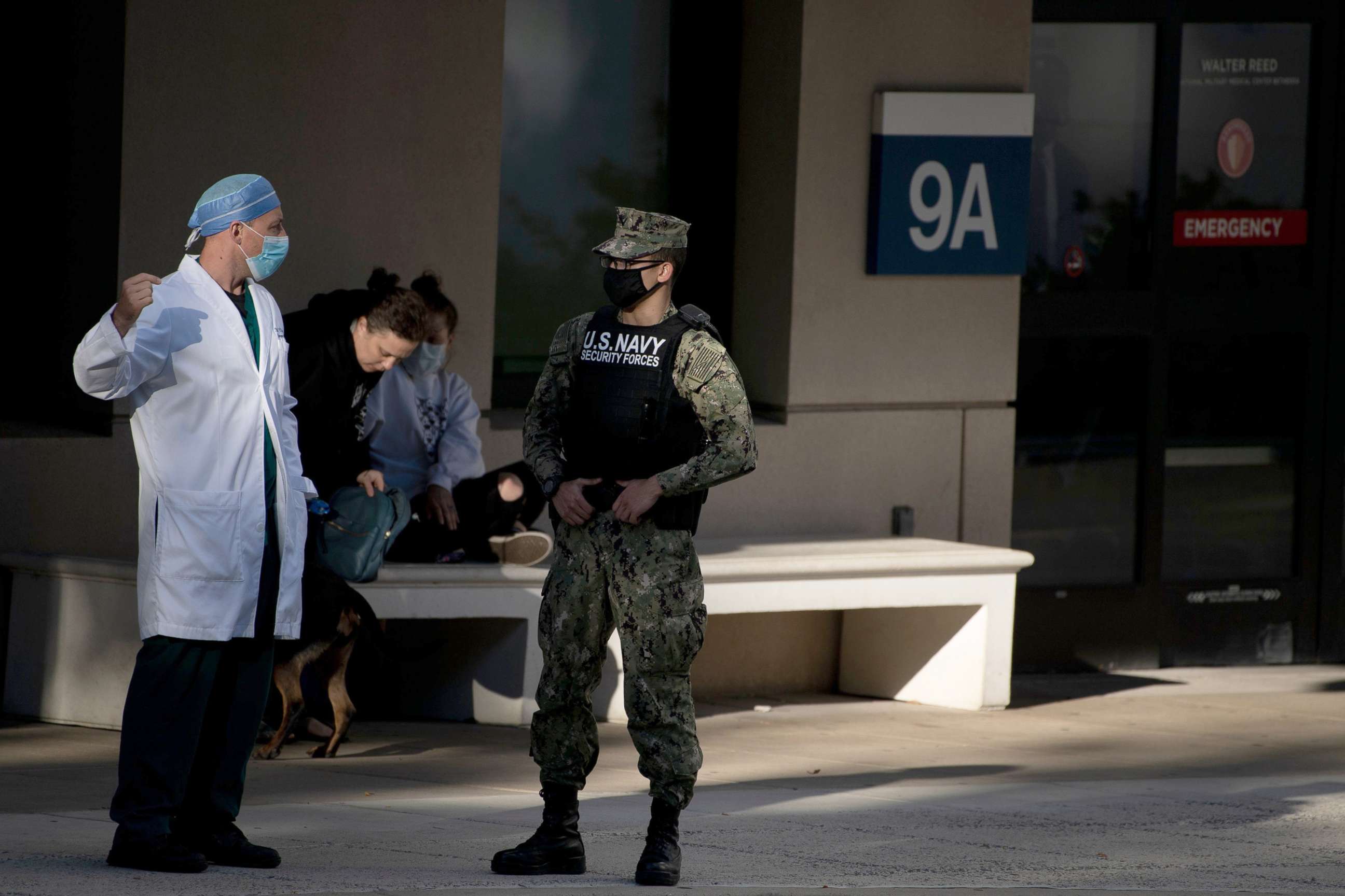 PHOTO: Navy security and medical personnel stand by the emergency entrance of Walter Reed National Military Medical Center, Oct. 2, 2020, in Bethesda, Md., ahead of President Donald Trump's expected arrival.