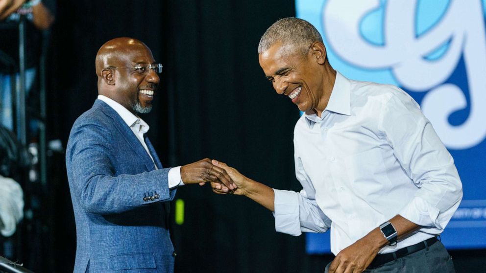 PHOTO: In this Oct. 28, 2022, file photo, former President Barack Obama greets Sen. Raphael Warnock as he arrives at a campaign event for Georgia Democrats on Oct. 28, 2022, in College Park, Ga.
