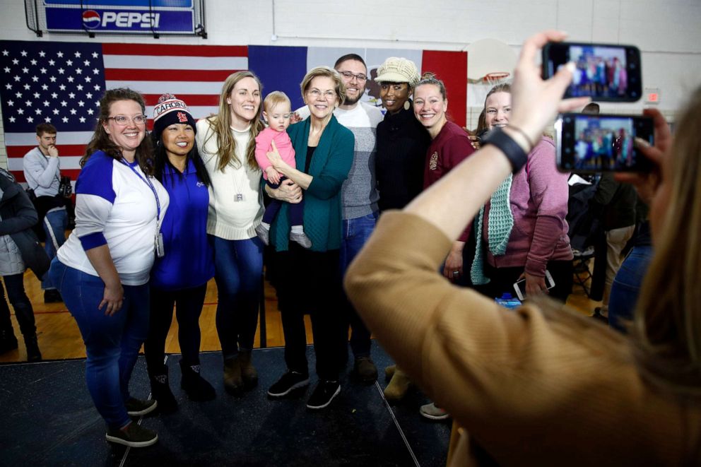 PHOTO: Democratic presidential candidate Sen. Elizabeth Warren, center, poses for photos with attendees after speaking at a campaign event, Jan. 19, 2020, in Des Moines, Iowa.