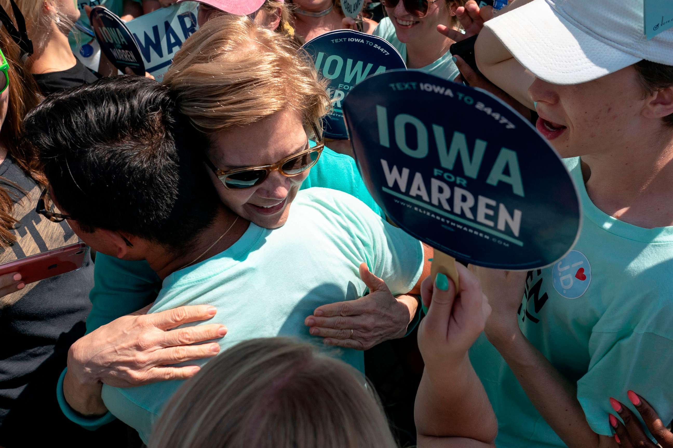 PHOTO: 2020 Democratic presidential hopeful Sen. Elizabeth Warren, D-Mass., greets supporters as she arrives at a rally outside the building where the Wing Ding Dinner will take place on Aug. 9, 2019 in Clear Lake, Iowa.