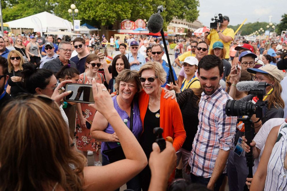 PHOTO: U.S. Senator and Democratic presidential candidate Elizabeth Warren takes a photograph with a supporter at the Iowa State Fair in Des Moines, Iowa, USA, August 10, 2019.