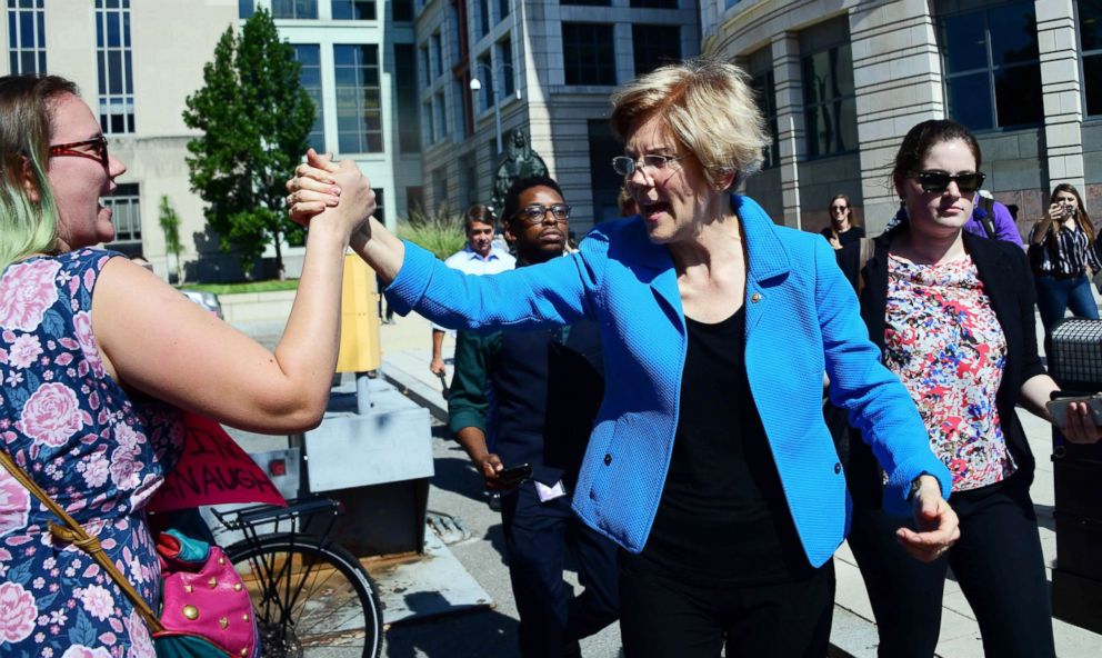 PHOTO: Sen. Elizabeth Warren greets demonstrators protesting US Supreme Court nominee Brett Kavanaugh on Oct. 4, 2018, in Washington. 