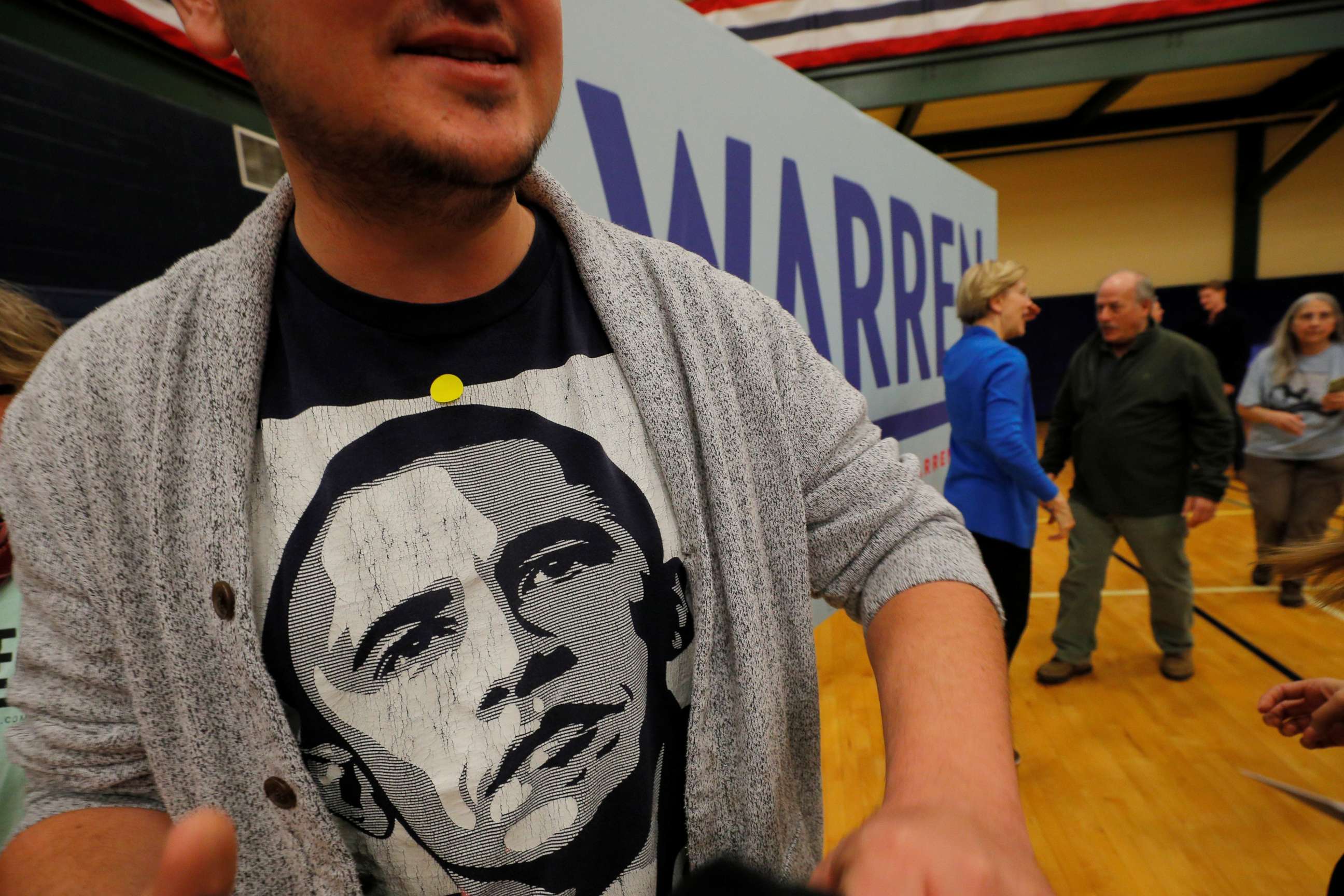 PHOTO: A voter wearing a T-shirt of former President Barack Obama walks away after posing for a photograph with Democratic 2020 presidential candidate and Sen. Elizabeth Warren, D-Mass., at a campaign event in Nashua, N.H., Feb. 5, 2020. 