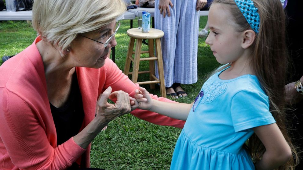 PHOTO: Democratic presidential candidate Sen. Elizabeth Warren, D-Mass., makes a pinky promise with Jessica Scaife, 8, of Bettendorf, Iowa, at a campaign event, Wednesday, Aug. 14, 2019, in Franconia, N.H.