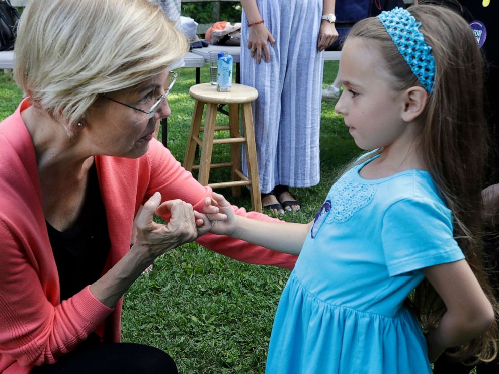 PHOTO: Democratic presidential candidate Sen. Elizabeth Warren, D-Mass., makes a pinky promise with Jessica Scaife, 8, of Bettendorf, Iowa, at a campaign event, Wednesday, Aug. 14, 2019, in Franconia, N.H.