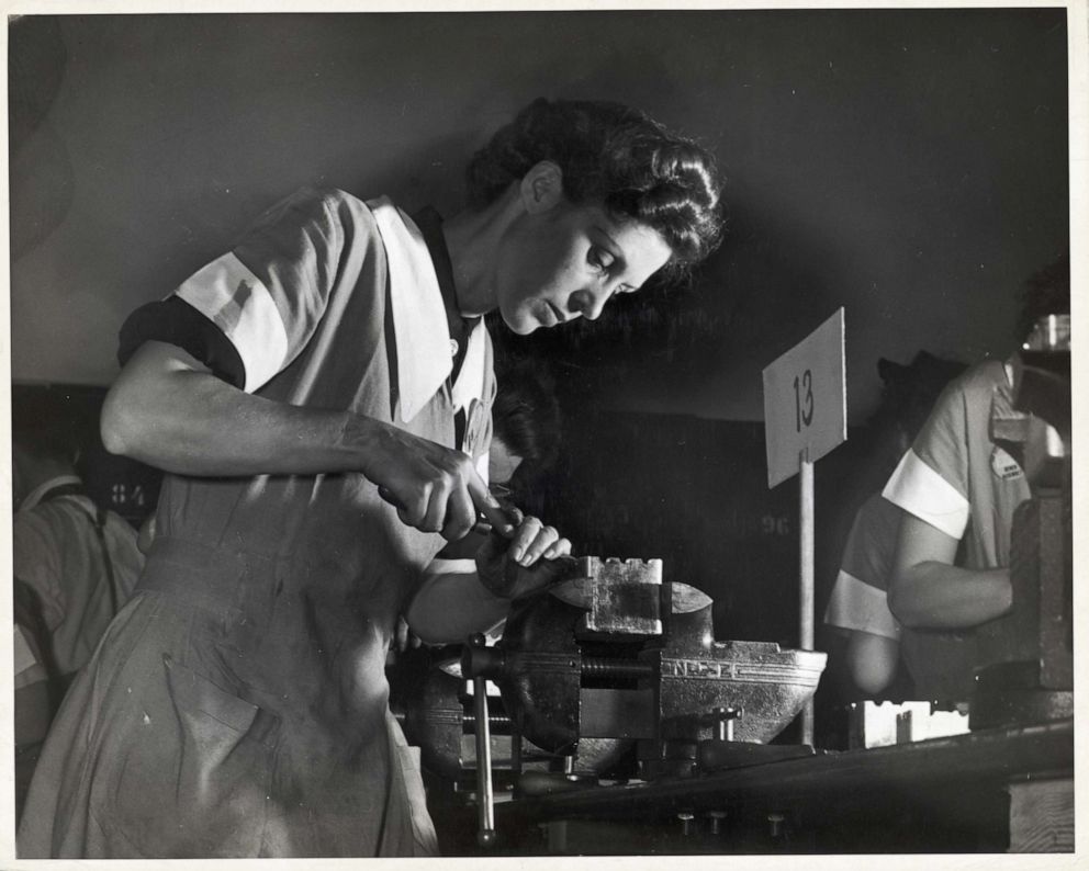 PHOTO: A photo taken between 1940 and 1945, shows a woman scraping a bearing in a vocational school in New York. 