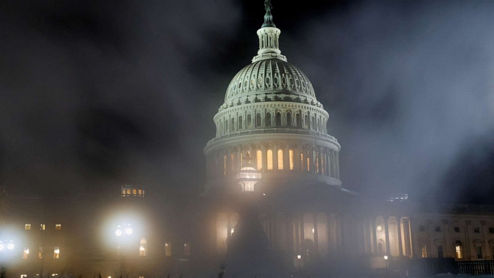 PHOTO: The U.S. Capitol is seen through a steam exhaust on the first anniversary of the January 6, 2021 attack on the Capitol in Washington, D.C., Jan. 6, 2022.