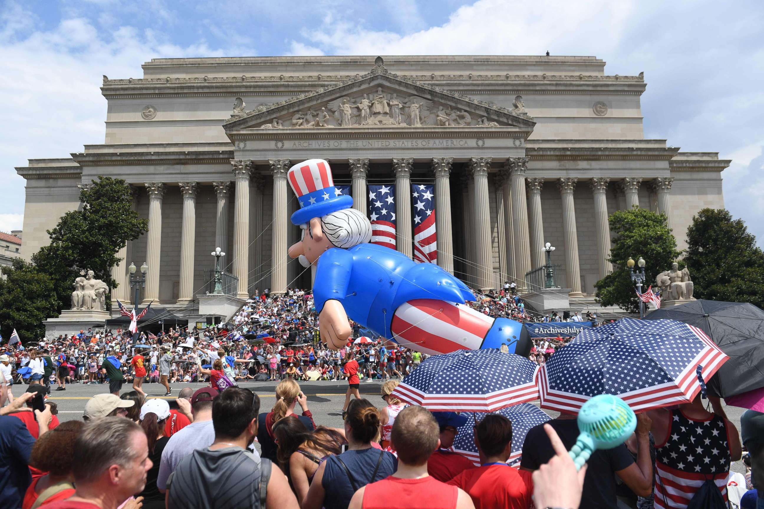 PHOTO: People watch the Independence Day parade as it passes in front of the National Archives in Washington, D.C., on July 4, 2019.