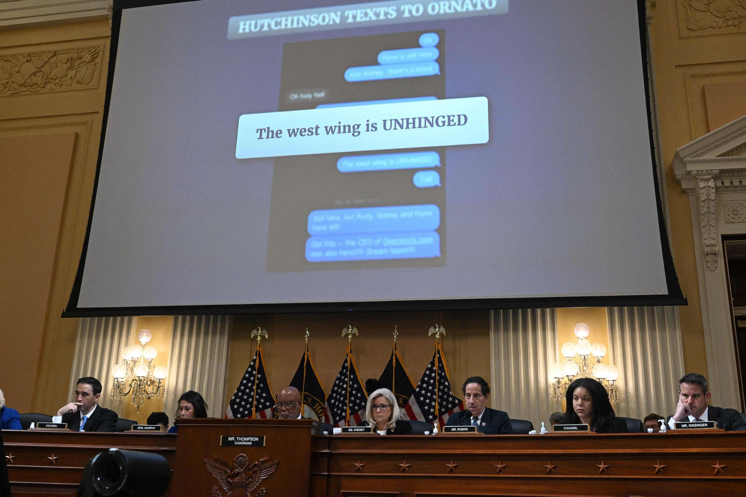 PHOTO: An evidence document with the message from Cassidy Hutchinson reads "The West wing is UNHINGED" is shown on a screen during a full committee hearing on "the January 6th Investigation," on Capitol Hill ,  July 12, 2022.