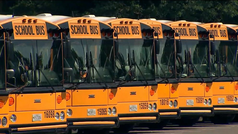 PHOTO: A line of school buses sit in a parking lot in the Washington D.C. metro area, July 13, 2020.