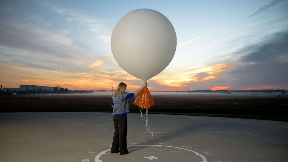 PHOTO: Meteorologist, Carrie Suffern prepares to release a weather balloon at the National Weather Service Headquarters, Oct. 1, 2012, in Sterling, Va.