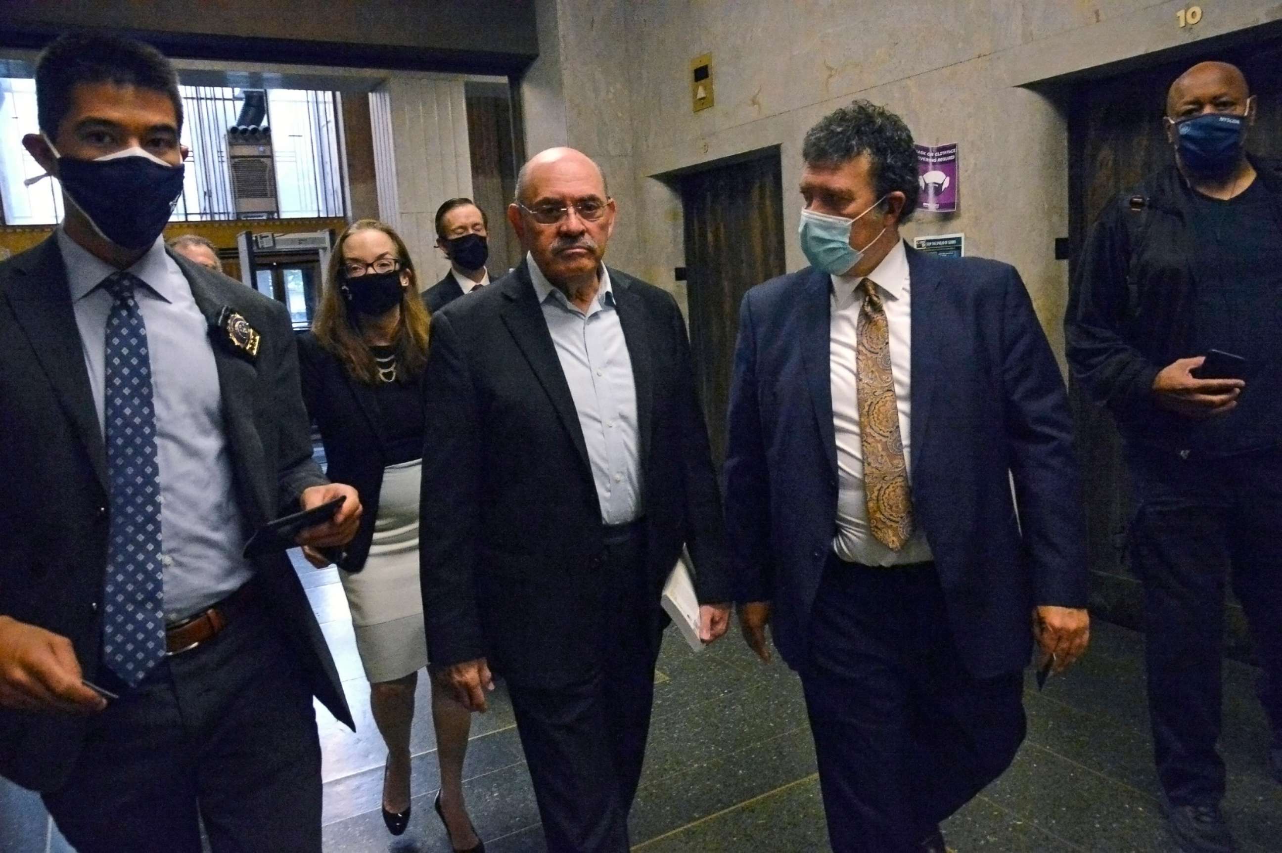 PHOTO: Allen Weisselberg, second from left, Donald Trump's long-serving chief financial officer, surrenders on July 1, 2021, at the lower Manhattan building that houses the criminal courts and the district attorney's office. 