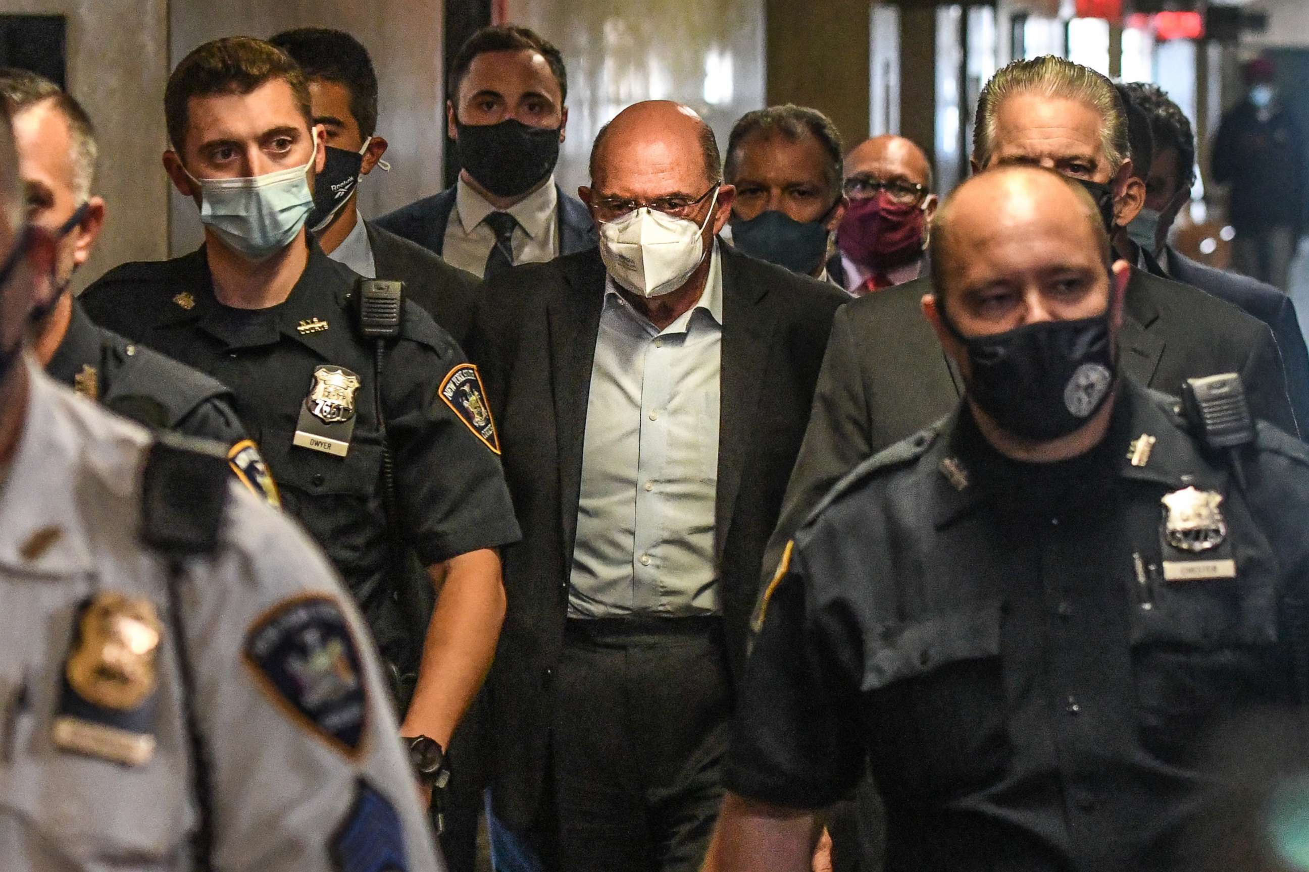 PHOTO: Allen Weisselberg, chief financial officer of Trump Organization Inc., center, walks towards a courtroom at criminal court in New York, July 1, 2021.