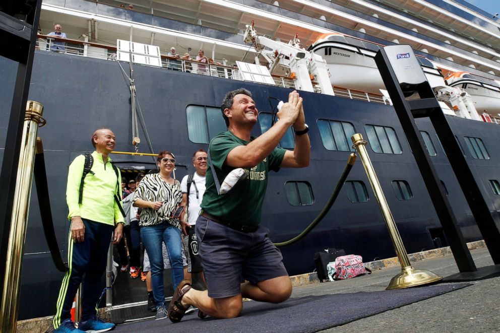 FILE PHOTO: John Miller, from Orcas Island, Wash., reacts after he disembarked from the MS Westerdam, at the port of Sihanoukville, Cambodia on Feb. 4, 2020.
