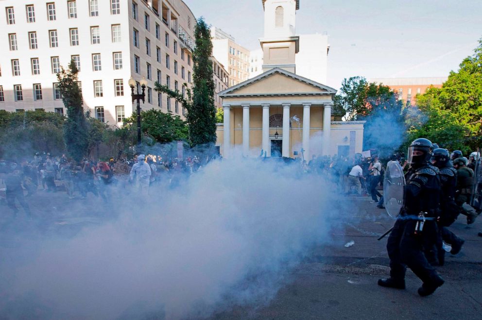 PHOTO: Police officers wearing riot gear push back demonstrators in front of St. John's Episcopal Church  outside of the White House, June 1, 2020, in Washington D.C., during a protest over the death of George Floyd.