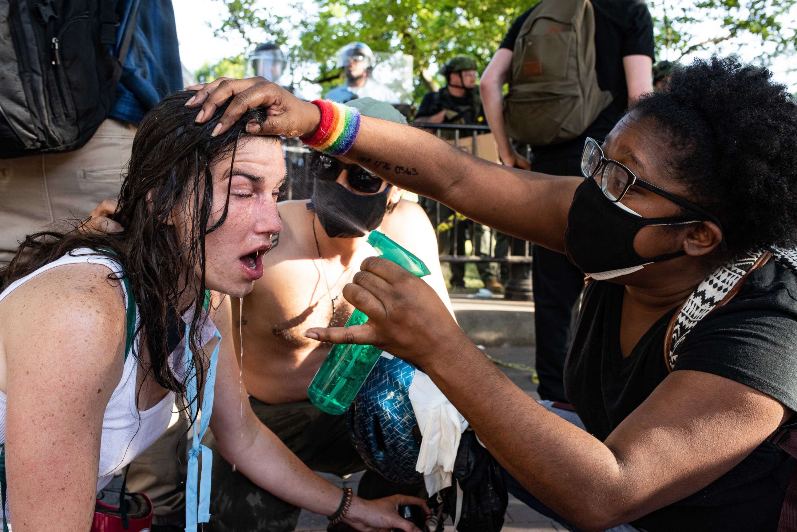 PHOTO: A woman has her eyes rinsed out, in Lafayette Square, near the White House, on June 1, 2020.