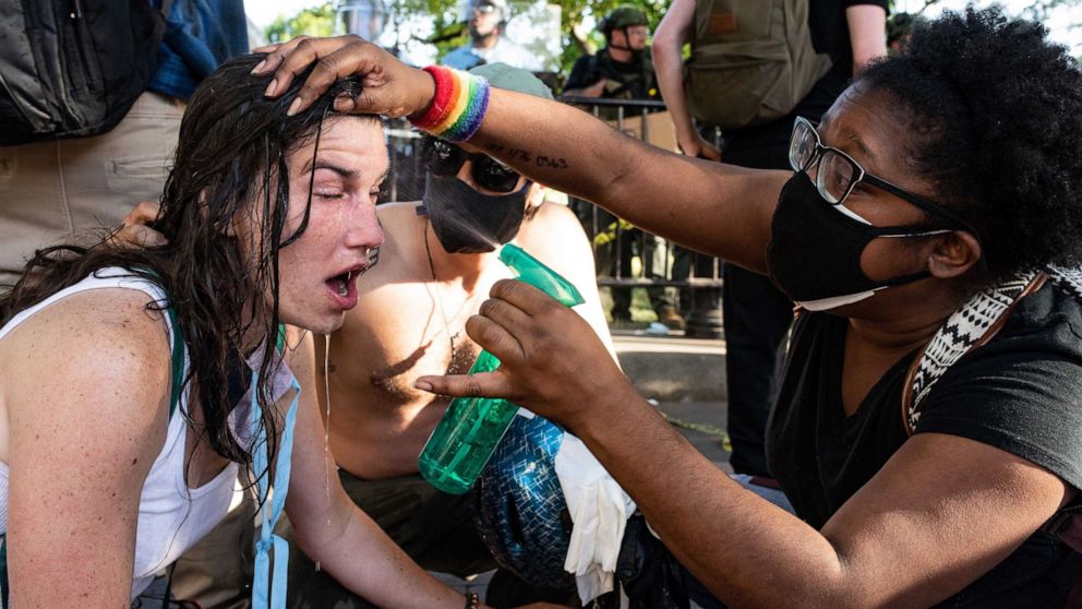 VIDEO: Police use tear gas, push back peaceful protesters for Trump church visit