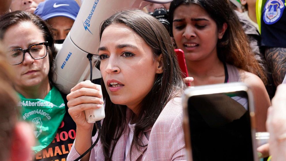 PHOTO: Rep. Alexandria Ocasio-Cortez joins abortion-rights activists as they demonstrate following Supreme Court's decision to overturn Roe v. Wade in Washington, June 24, 2022. 