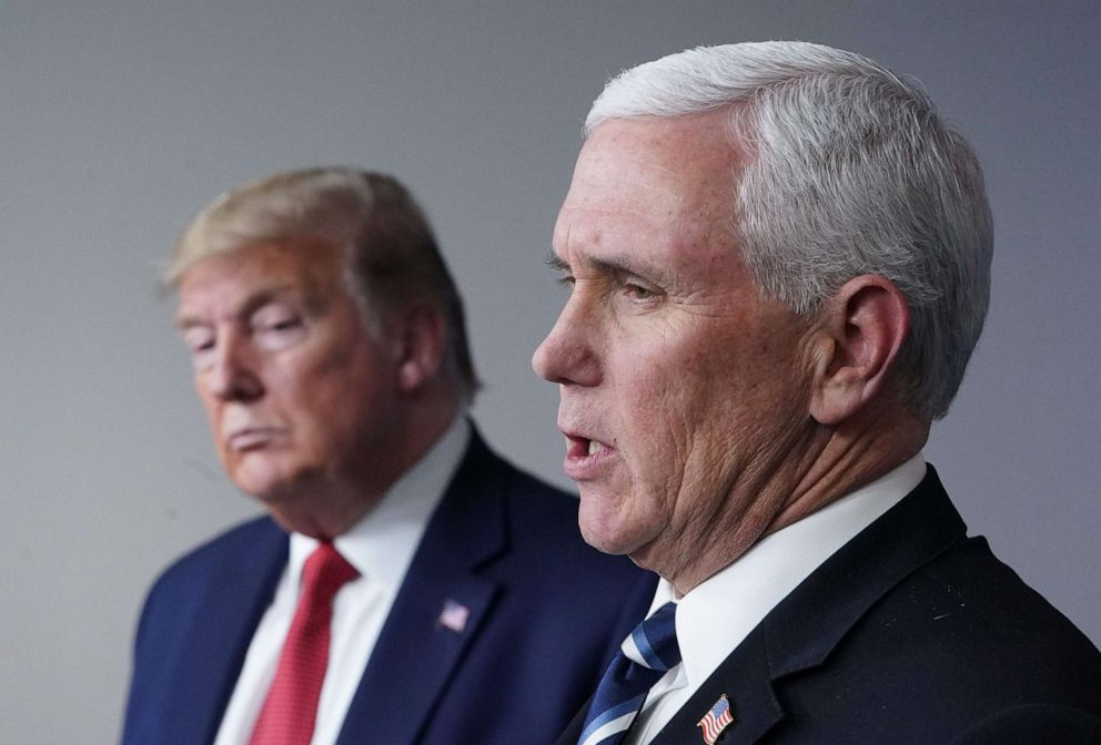 PHOTO: Flanked by President Donald Trump, Vice President Mike Pence speaks during the daily briefing on the novel coronavirus, which causes COVID-19, in the Brady Briefing Room of the White House, April 16, 2020, in Washington, DC.
