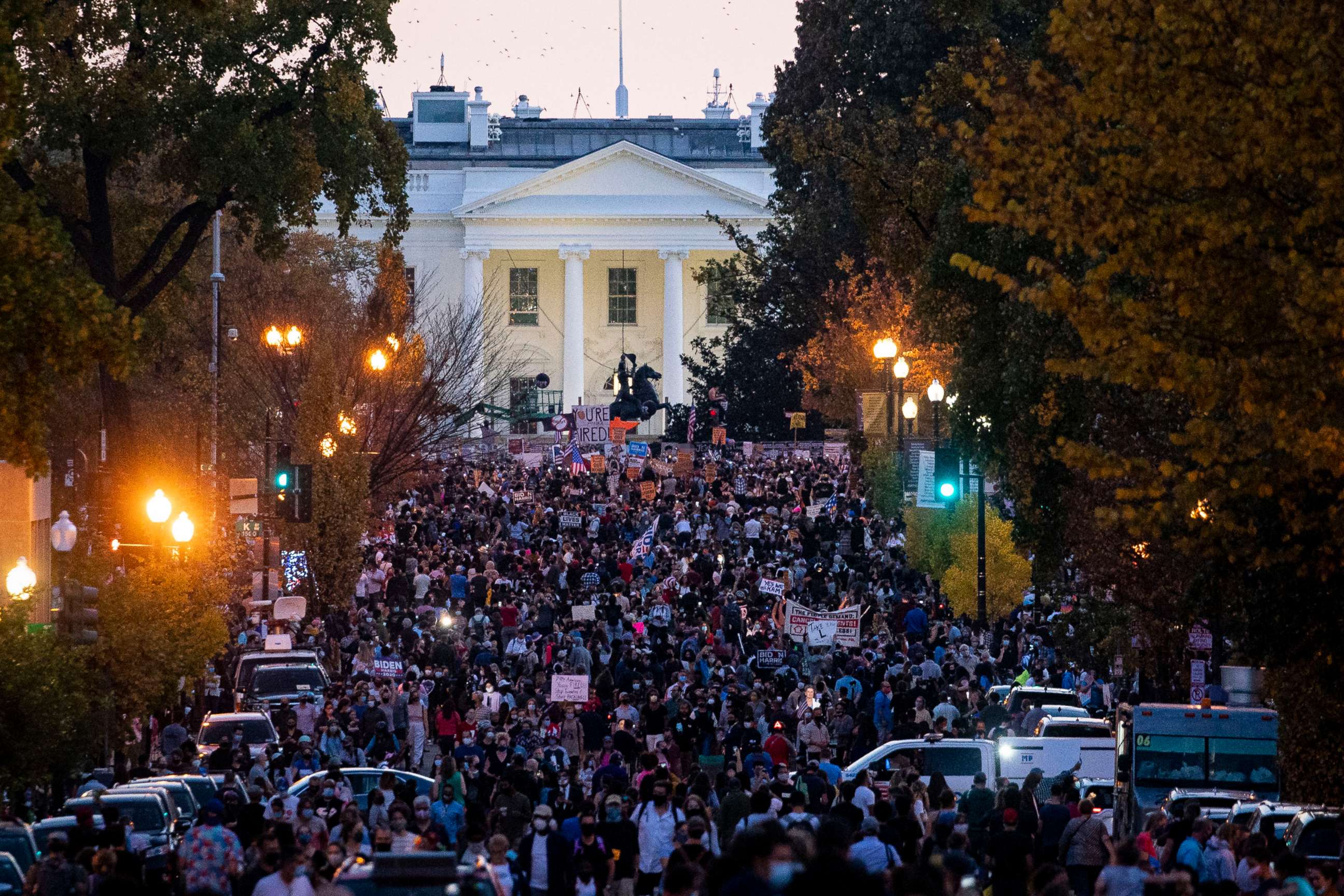 PHOTO: People gather in Black Lives Matter Plaza near the White House as they celebrate after Democratic nominee Joe Biden was declared winner of the 2020 presidential election on Nov. 7, 2020 in Washington, DC.