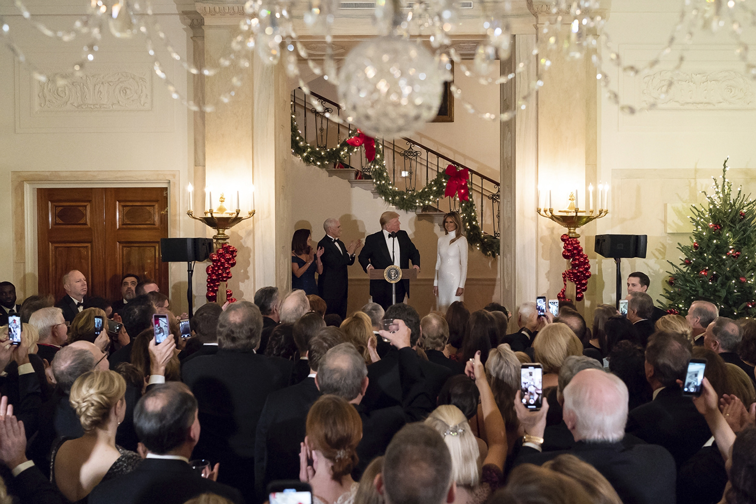 PHOTO: President Donald Trump, joined by First Lady Melania Trump, Vice President Mike Pence and Karen Pence, delivers remarks in the Grand Foyer of the White House, Dec. 15, 2018, in Washington, DC.