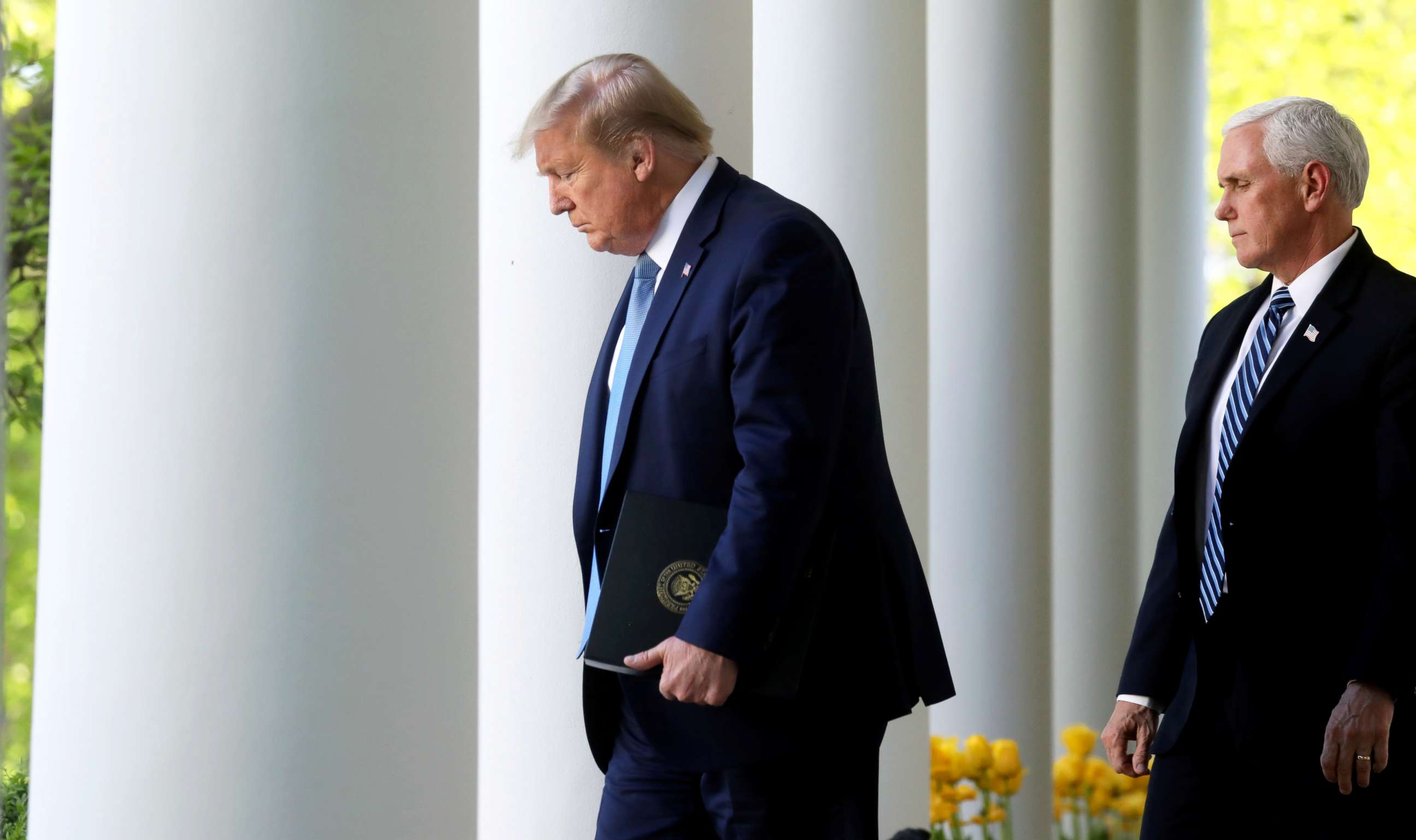 PHOTO: President Donald Trump arrives with Vice President Mike Pence for the daily coronavirus task force briefing in the Rose Garden at the White House in Washington, April 15, 2020.