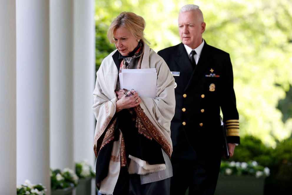 PHOTO: Dr. Deborah Birx and Admiral Brett Giroir walk to the Rose Garden to attend a briefing with President Donald Trump about the coronavirus at the White House, April 27, 2020, in Washington.