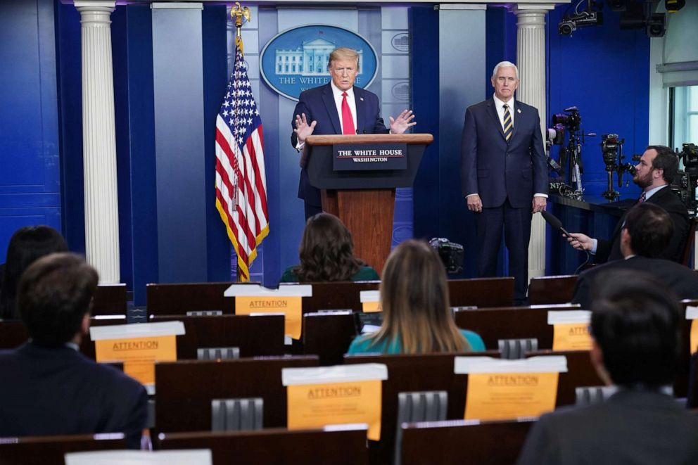 PHOTO: President Donald Trump speaks flanked by Vice President Mike Pence during the daily briefing on the novel coronavirus in the Brady Briefing Room of the White House on April 22, 2020, in Washington.
