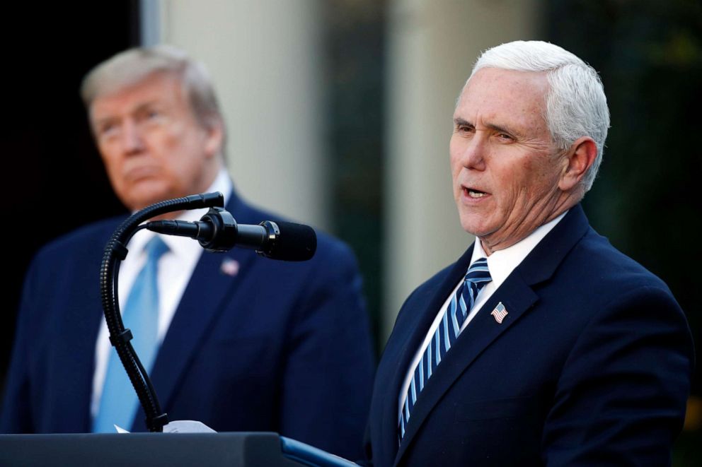 PHOTO: President Donald Trump listens as Vice President Mike Pence speaks about the coronavirus in the Rose Garden of the White House, April 15, 2020, in Washington.
