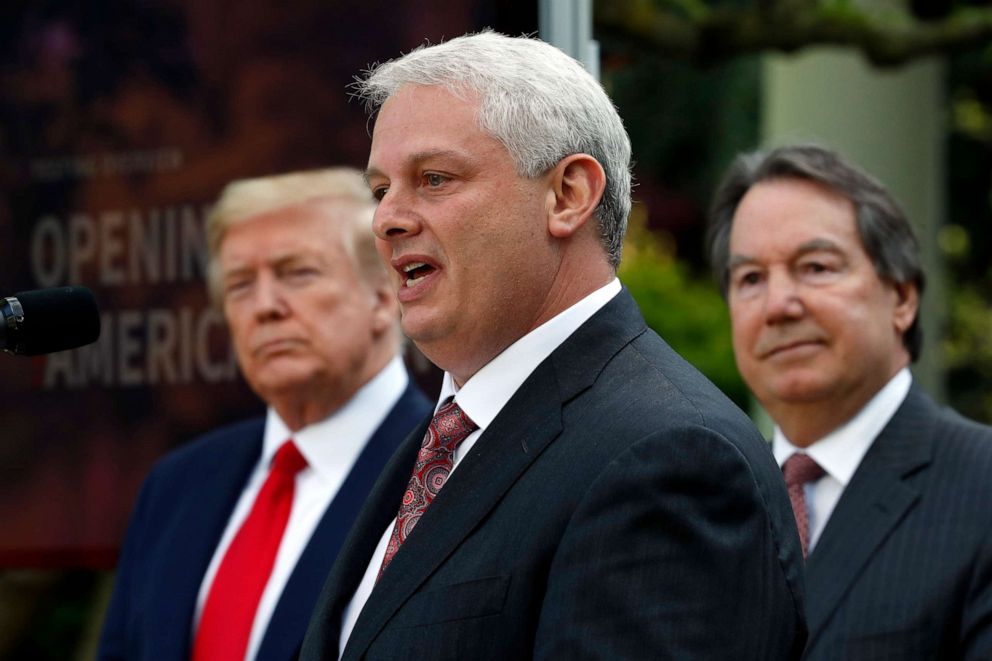 PHOTO: Adam Schecter, CEO of LabCorp, speaks about the coronavirus in the Rose Garden of the White House, Monday, April 27, 2020, in Washington, as President Donald Trump and Stephen Rusckowski, CEO of Quest Diagnostics listen.