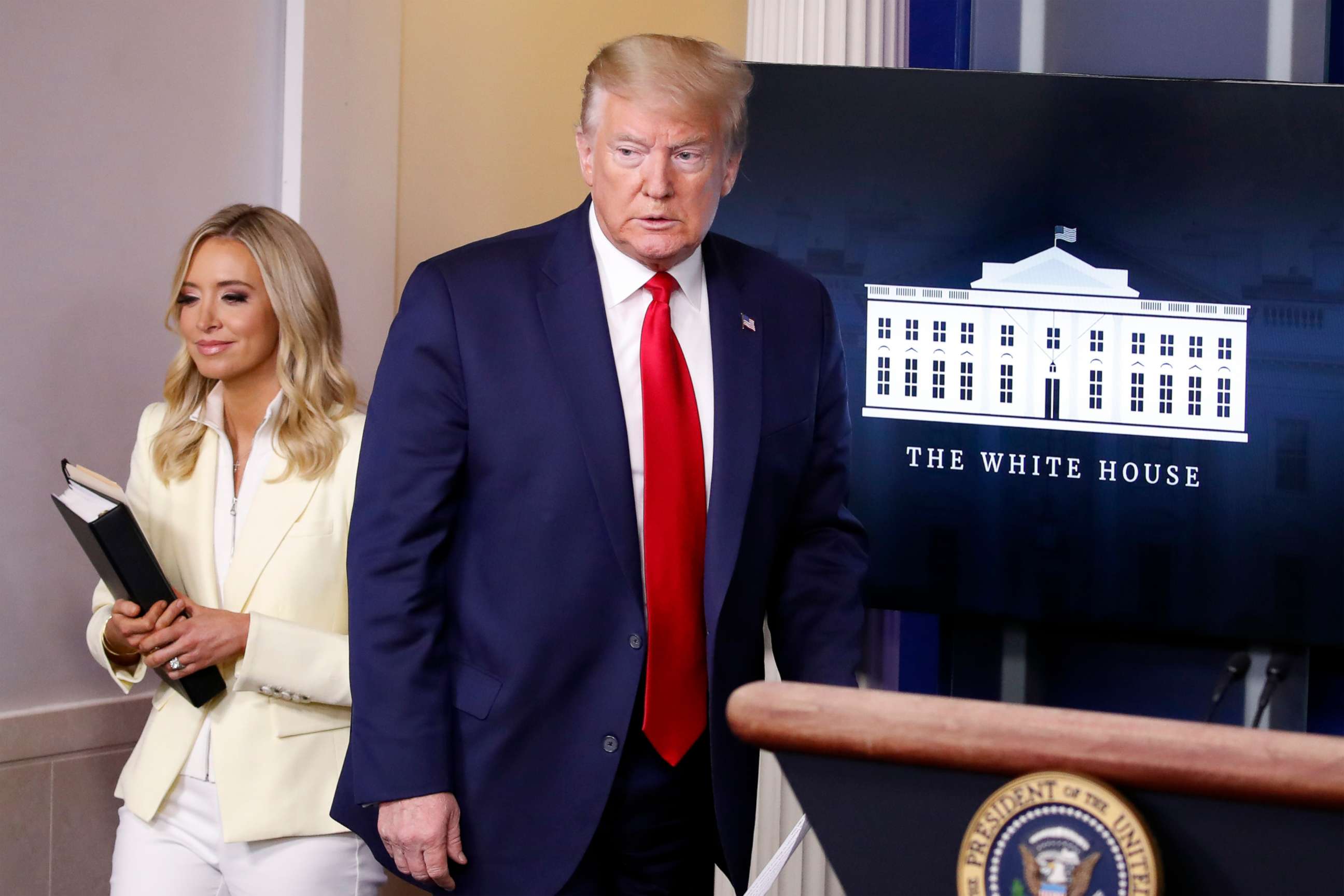 PHOTO: President Donald Trump arrives with White House press secretary Kayleigh McEnany to speak with reporters about the coronavirus in the James Brady Briefing Room of the White House, May 22, 2020, in Washington.