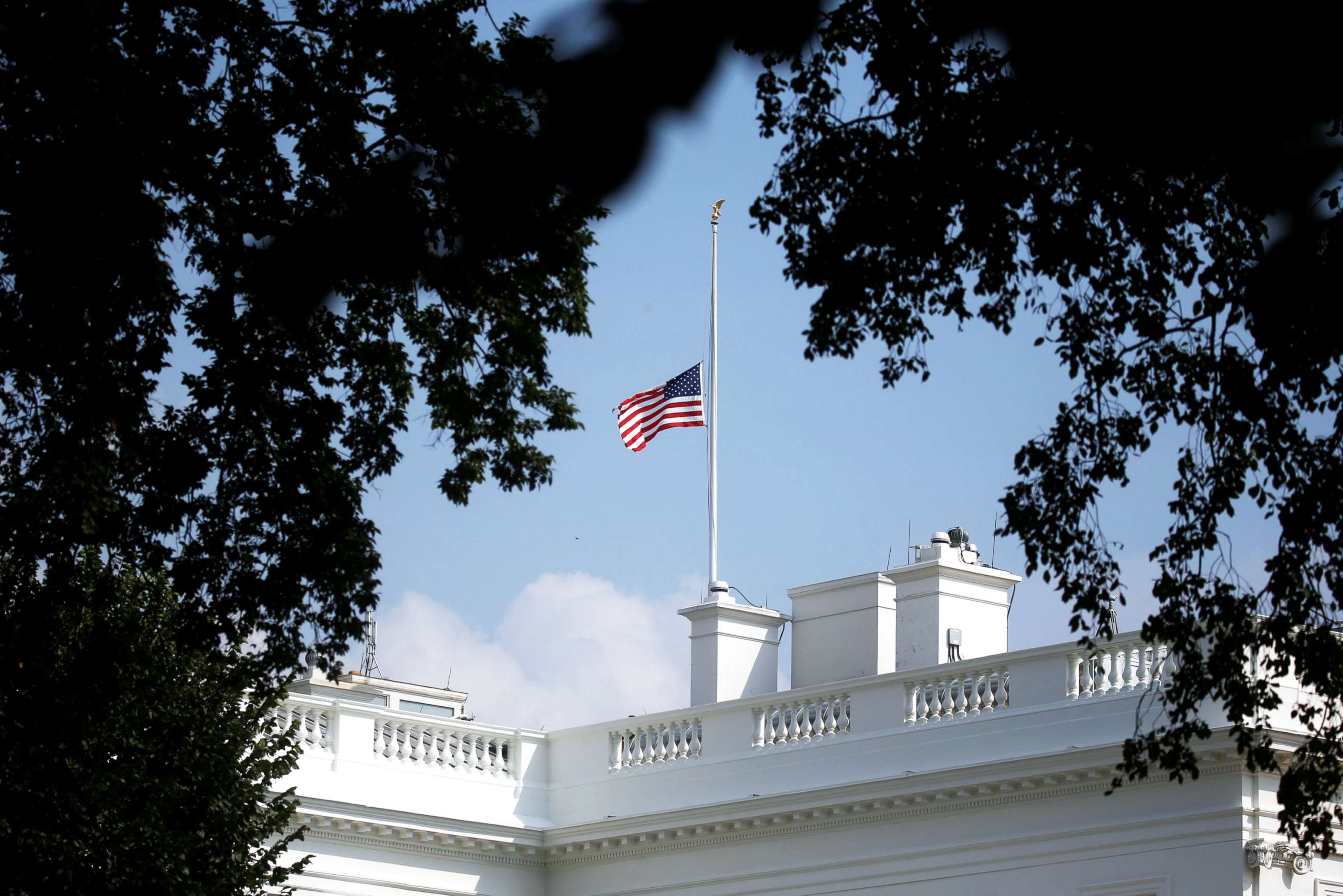 PHOTO: The White House flag is seen after being returned to half-staff in honor of Senator John McCain at the White House, Aug. 26, 2018.