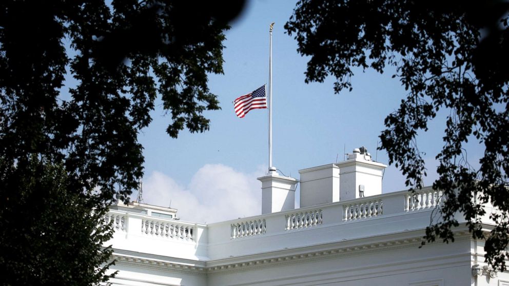 PHOTO: The White House flag is seen after being returned to half-staff in honor of Senator John McCain at the White House, Aug. 26, 2018.