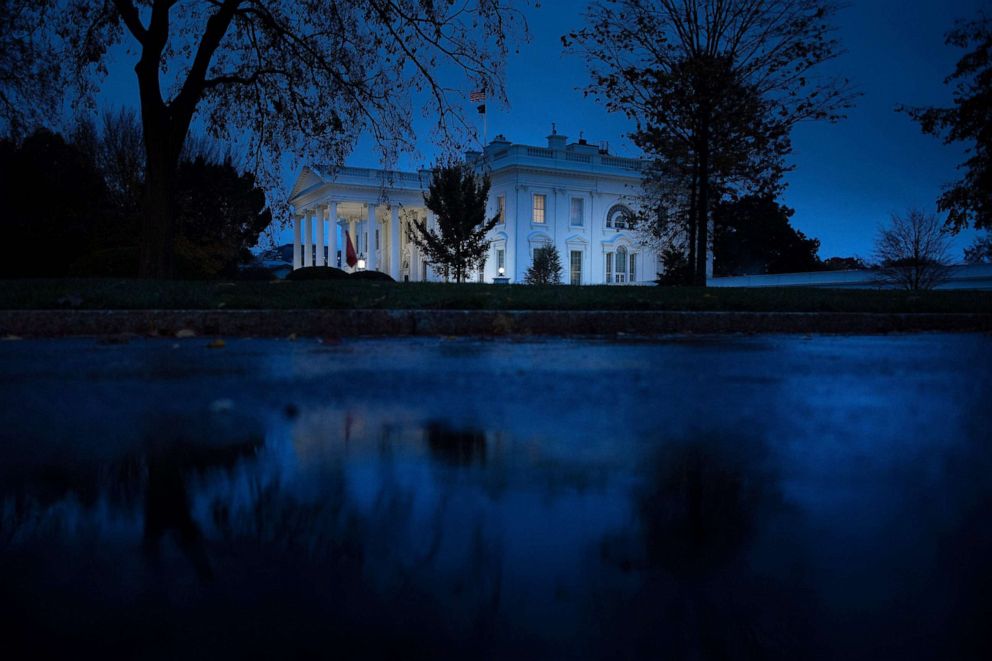 PHOTO: Rain makes puddles on a road outside the White House, Nov. 11, 2020, in Washington, D.C.