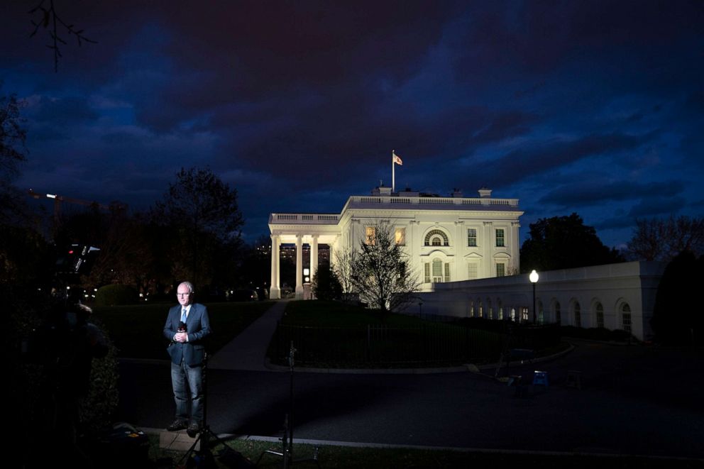 PHOTO: The media gathers outside the White House at dusk, Nov. 17, 2020 in Washington, DC. 