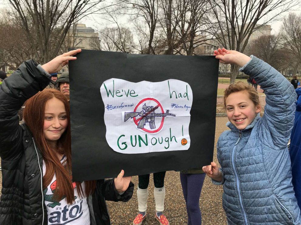 PHOTO: Parker Margulis, 12, and Pepper Margulis, 11, attend a rally against gun violence in front of the White House in the wake of the deadly high school shooting in Parkland, Florida. 